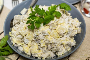 Chicken salad with pineapple cheese and mushrooms in plate