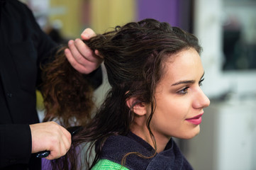 young woman in hairdresser salon