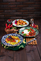 different dishes on a wooden background in Oriental style