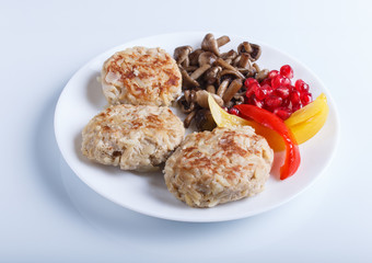 meatballs with rice mushrooms, sweet peppers and pomegranate seeds isolated on white background.