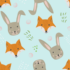 Cute seamless pattern with cartoon orange fox and gray hare heads with grass on blue background. Funny hand drawn foxy and rabbit texture for kids design, wallpaper, textile, wrapping paper