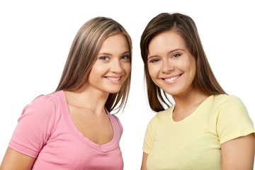 Portrait of Two Smiling Girlfriends / Sisters