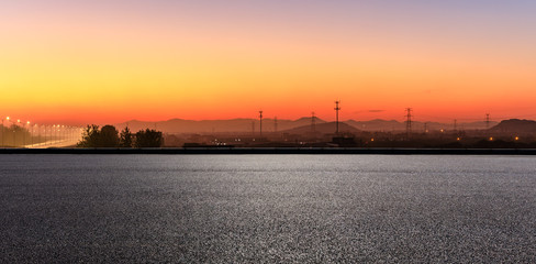 Empty asphalt road and mountains at beautiful sunset,panoramic view