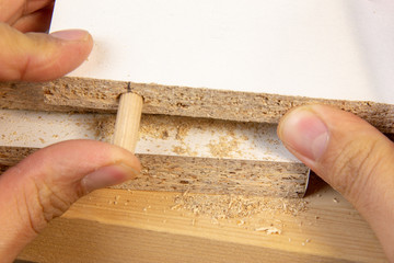 Furniture assembly. Master inserts a self-tapping bit