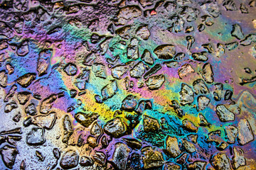 Rainbow Liquid Petrol Pollution Leak on Asphult Road