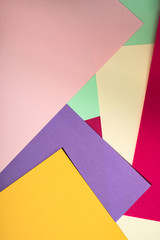 Colorful polygon paper design. Pastel tones geometric shapes background.