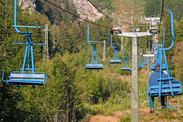 Obraz na płótnie Canvas Chair lift that climbs to the lookout point on the slopes of Monte Rosa above Macugnaga in Piedmont, Italy