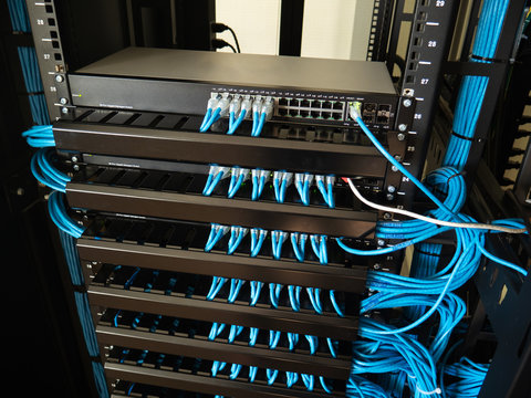Network switch and ethernet lan cables connect to computer network  system