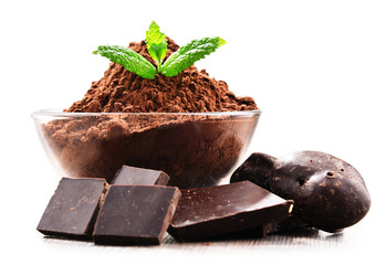 Composition with bowl of cocoa powder isolated on white
