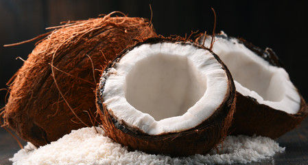 Composition with bowl of shredded coconut and shells