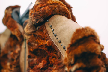  Brown jacket made of natural fox fur with elements of leather and metal. demi-season clothing.