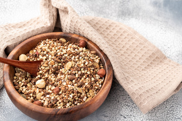 Healthy breakfast, vegan vegetarian granola made of green buckwheat with nuts and pumpkin seed