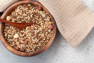 Healthy breakfast, vegan vegetarian granola made of green buckwheat with nuts and pumpkin seed