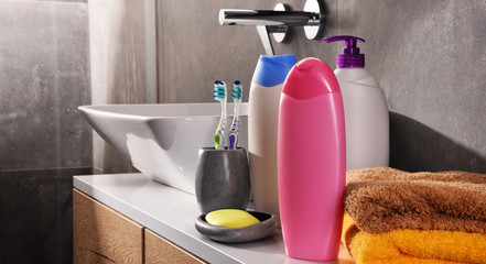 Plastic bottles of body care and beauty products in the bathroom