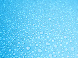 closeup drops water on blue background