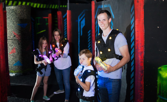 Father and son playing laser tag