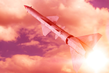 nuclear missile launched into the air against the evening sky. the threat of nuclear weapons.