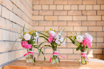 floral arrangement for interior decoration, table setting for a wedding or to create a home cosiness. use as background. pink roses