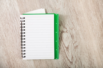 Notebook in line on table