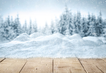 Table background with snow and free space for your decoration 