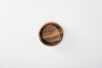 top view of wooden bowl on white background