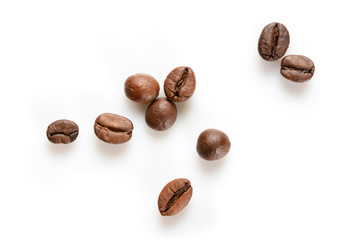Coffee beans. Some roasted coffee beans, close up, isolated on white background.