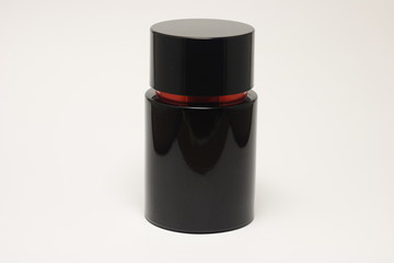 Men black and red bottle perfume isolated on a white background