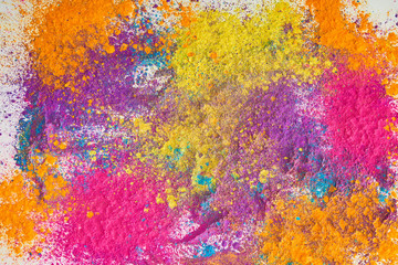 top view of explosion of multicolored holi powder