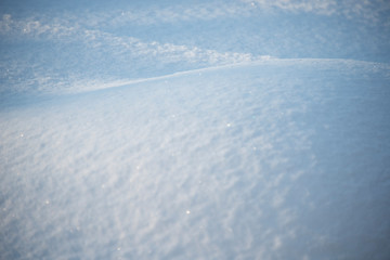 Fototapeta na wymiar the natural background - snow surface in sunshine