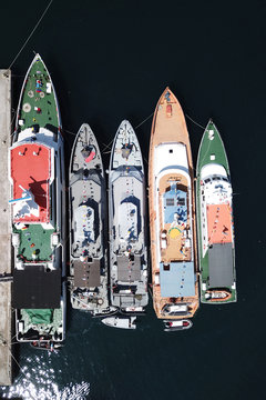 Aerial view of five ships docked in Badas harbor, Sumbawa, Indonesia