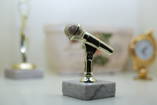 golden microphone figurine
