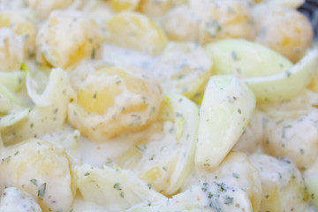 raw potatoes in sauce