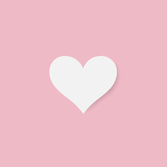 Fototapeta na wymiar Paper cut white heart on pink background.