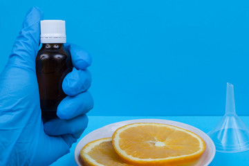 bottle in hand, orange on a plate