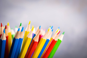Pencils colorul color wooden pencil in metal holder in front of wall background