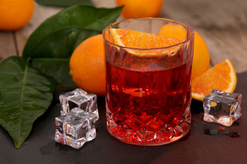 Negroni Cocktail with orange and ice. A glass of aperitivo with Campari, Vermouth, Gin and Oranges....