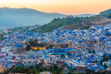 Fototapeta na wymiar Beautiful sunset over the cityscape of Chefchaouen, the blue city of Morocco