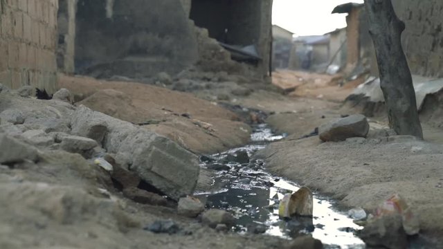 ruins of an old village in africa, detail slop river