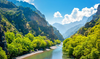 Panorama of the mountains in Greece in the area Zagori, the river flowing in the canyon