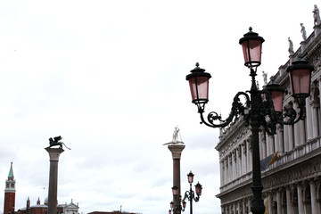 San Marco square in Venice Italy in rainy day. Column with lion. Palace