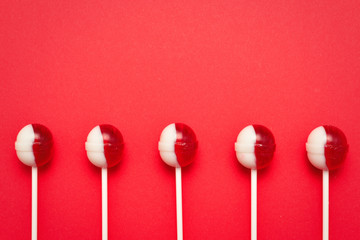 Lollipop on a red background. Space for text or design.