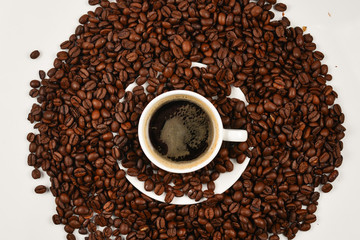 Cup of coffee and coffee beans.