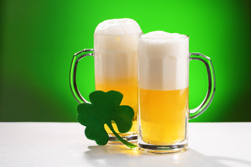 Two mugs of beer. Concept for St. Patrick's day.