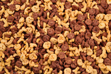  Chocolate flakes in the form of skulls and bones background. Top view.