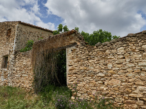 Facade of an old abandoned house in the mountains of Enguera, Spain