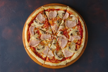 Top view of pizza with champignon, ham and sausage
