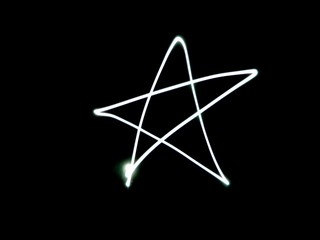 Light painting. Star on black background