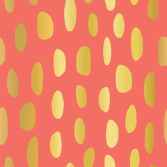 Abstract gold foil spot shapes seamless vector pattern. Shiny metallic golden marks on coral background. Modern strokes design for fabric, packaging , digital paper, web banner, page fill, wrapping.