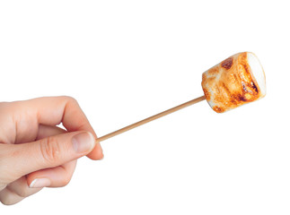 roasted marshmallows on a skewer on white background