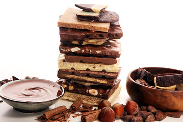 Chocolate bars on table with chocolate tower.